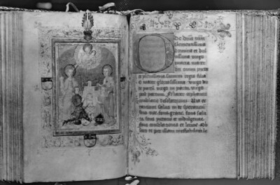 fol. 167v-168r: Couple of Donors with Saints Barbara and John Ev. under the Madonna Lory, in the border the coat of arms of Clas von Bacharach and his wife Lysbeth Struyss for the Campe