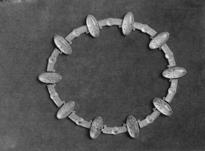 Necklace with stylized twigs and beetles
