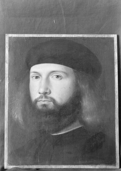 Young man with black whole beard and blond hair