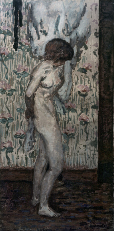 Female nude in front of pink wallpaper