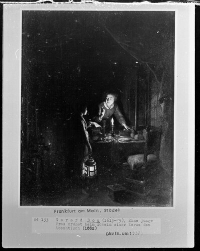 Woman arranging dinner table