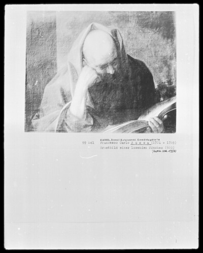 Chest of a reading monk