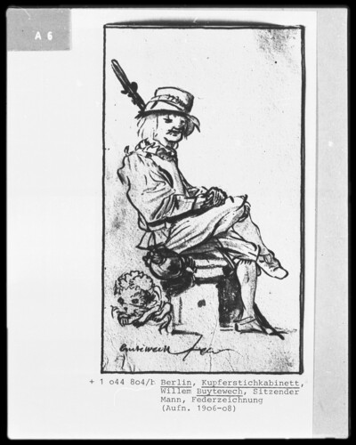Sitting man, facing to the right, with his legs covered