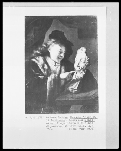 Young man with plaster mask
