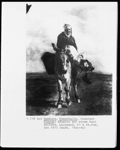 Farmer riding on a donkey