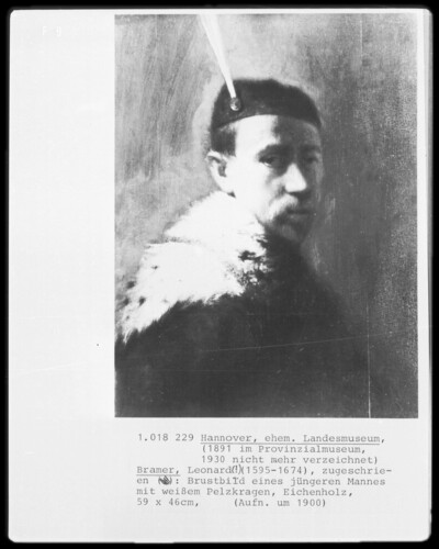 Chest of a younger man with white fur collar
