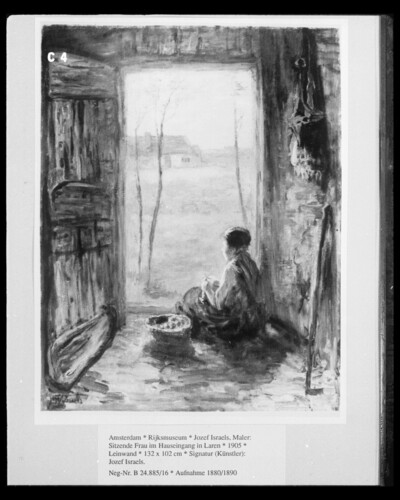 Seated woman in the house entrance in Laren