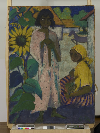 Two gypsies with sunflower and horse in the background