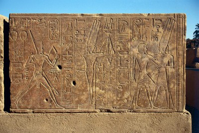 Queen Hatshepsut dancing before a representation of Min