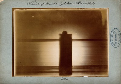 The door of Röntgen's laboratory, with a platinum plate attached to the handle, viewed under x-ray. Photoprint from radiograph by W.K. von Röntgen, 1895.