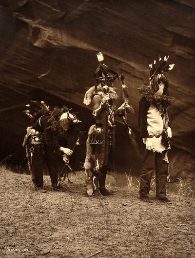 A 'Yebichai Sweat' Navajo medicine ceremony: three Navajos in ceremonial dress with faces masked