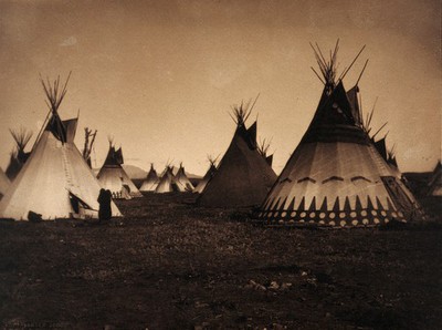 A Piegan Indian encampment, North America: tipis, including a decorated medicine tipi.