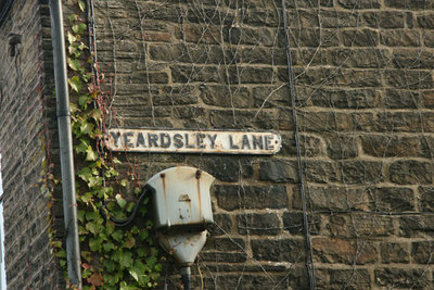 Sign for Yeardsley Lane, Furness Vale. Looking SW from SK007835.