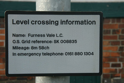 Level crossing information sign, Furness Vale. Looking NE from SK008835.