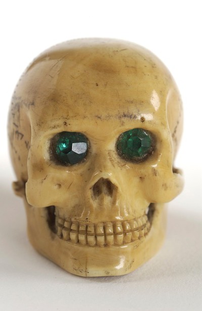 Whalebone walking stick with skull pommel in ivory with green glass ...